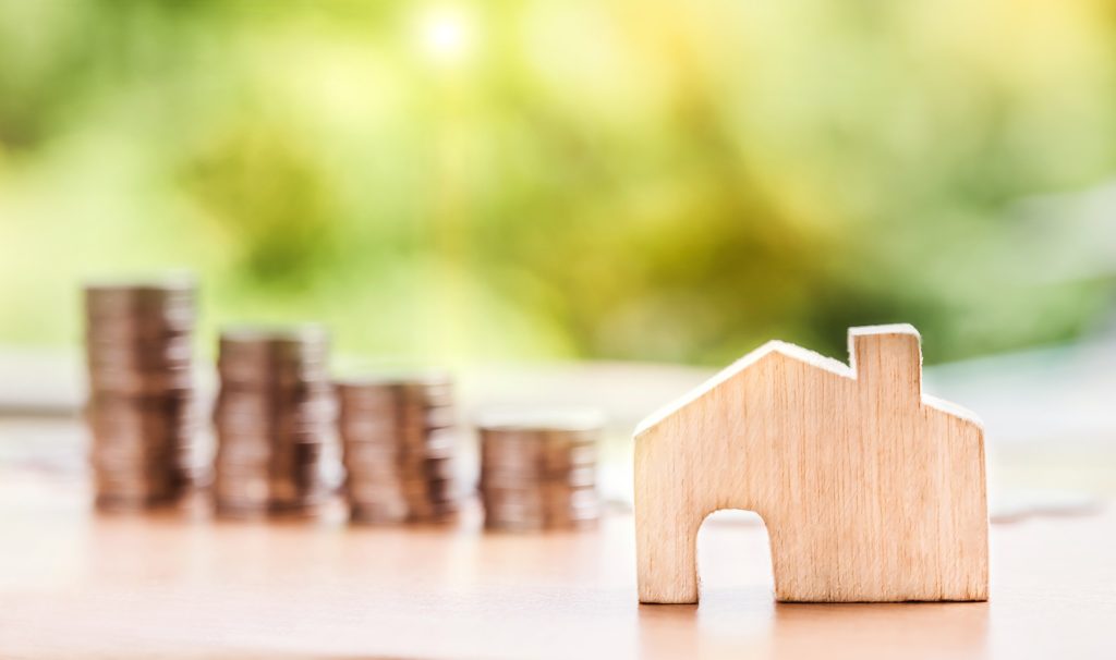 Image of Home Representing Insurance Claims insurance claims after a natural disaster represented by a house and money
