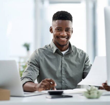 Man at computer happy in office