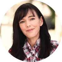 Headshot of a smiling woman with black hair
