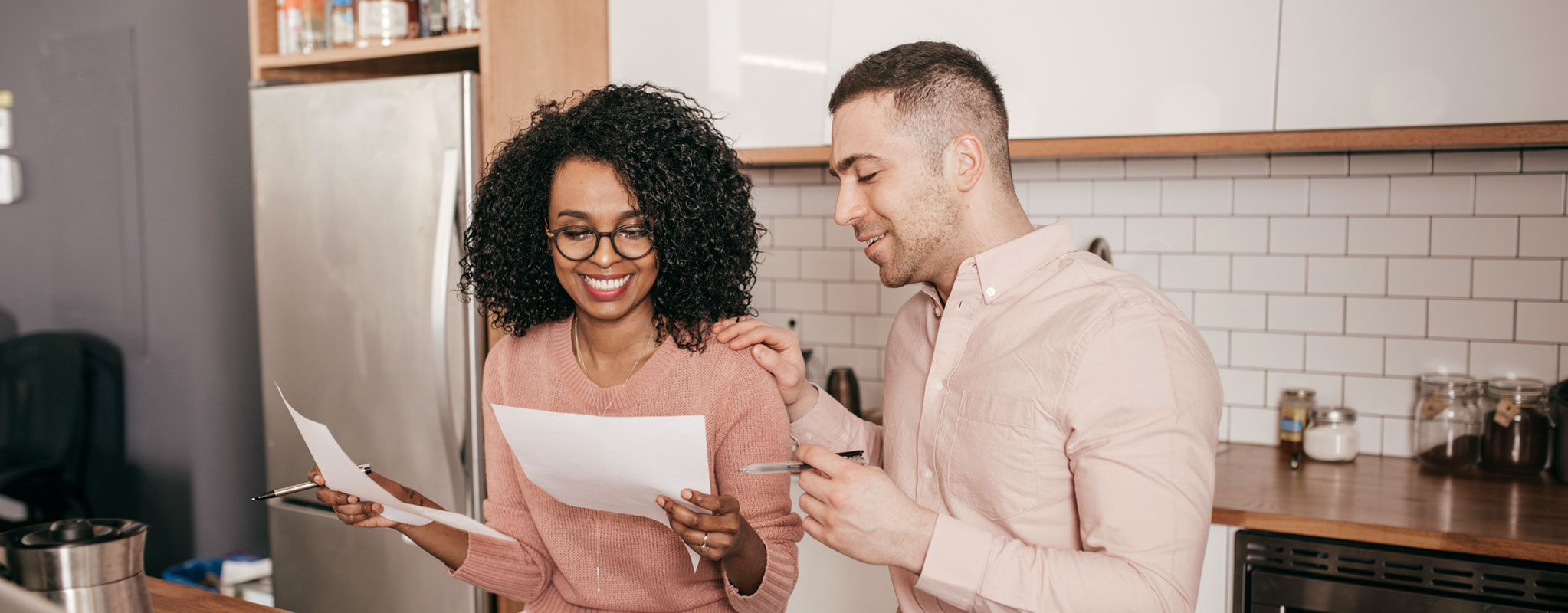 young couple discussing paperwork