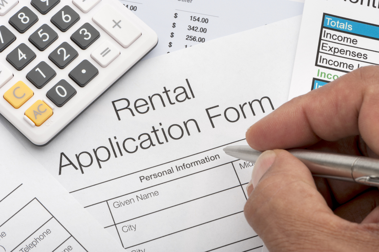 person filling out rental application