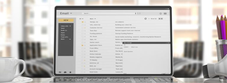 email screen on laptop computer sitting on desk