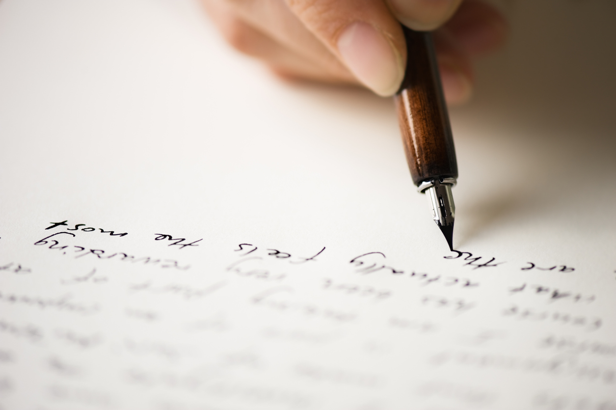 person hand writing welcome note