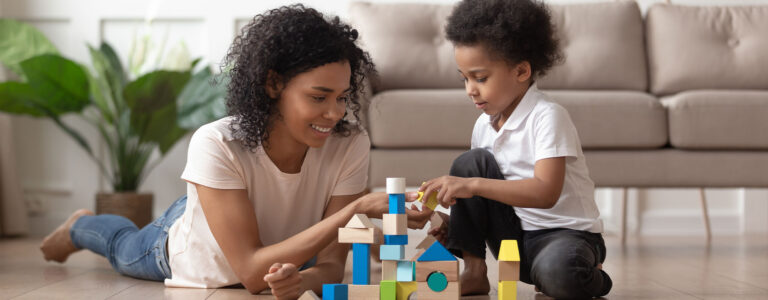 mother and son playing with blocks