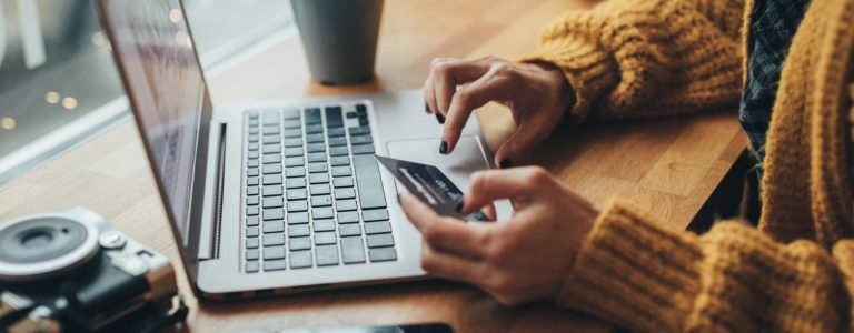 Woman paying security deposit on her laptop