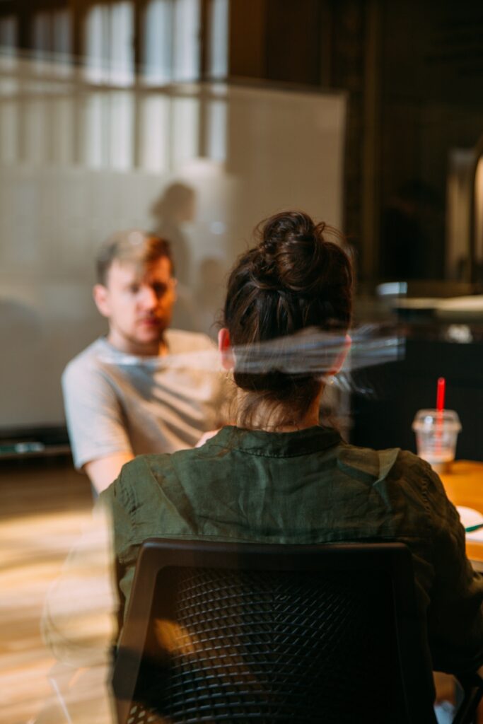 meeting behind glass in office