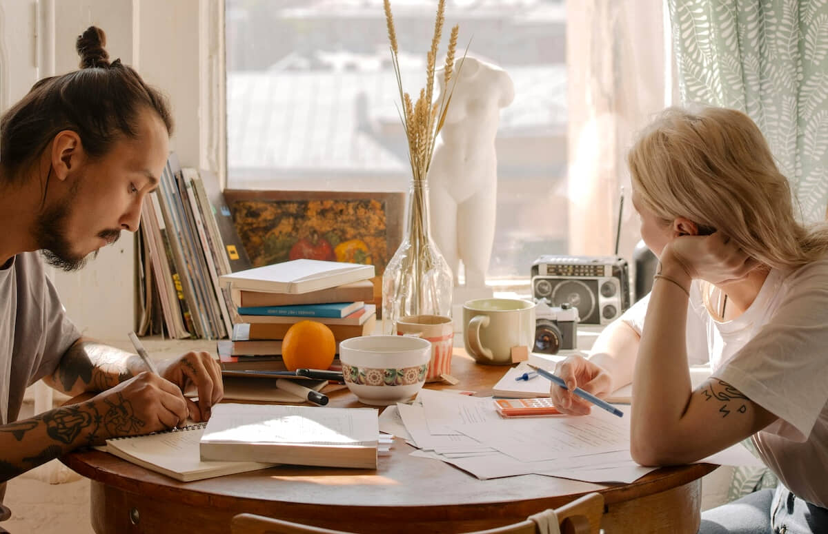 Landlord and their tenant sitting together at a table