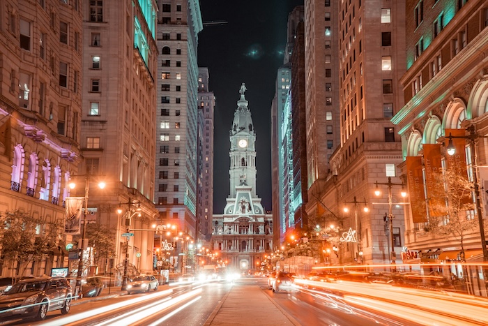 Lit up street at night looking towards a watchtower in Philadelphia, Pennsylvania
